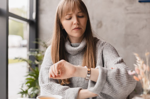 A woman checking her watch.